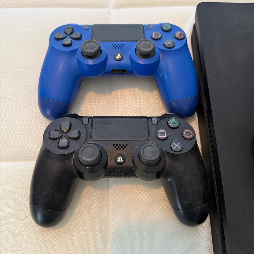 Sony PS4 Console with Blue and Black Controllers and 17 games